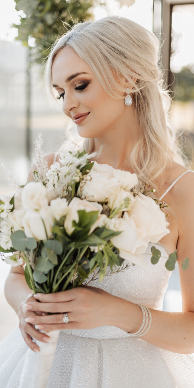 bride holding flowers