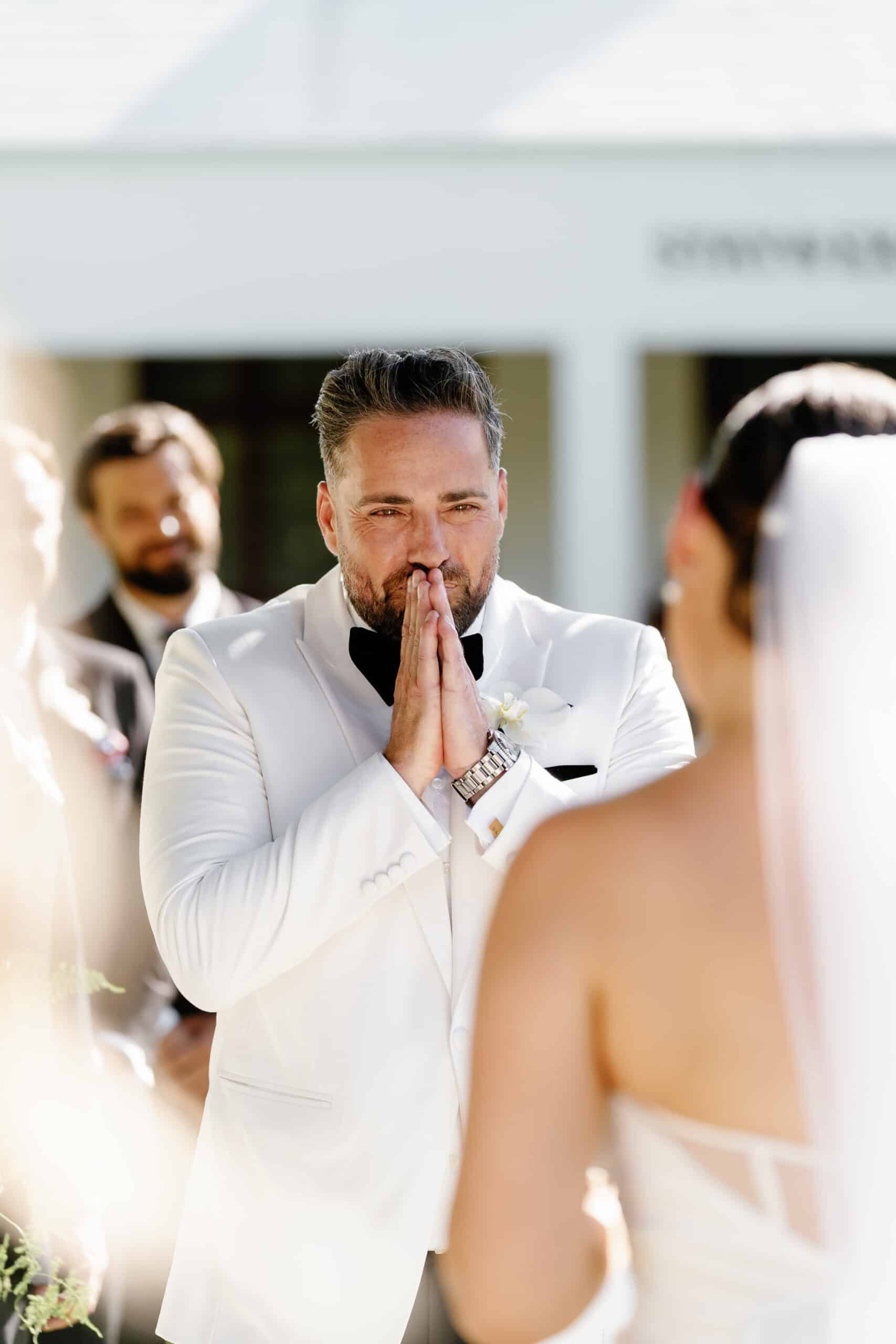Groom overcome with emotion as he sees his bride at the aisle