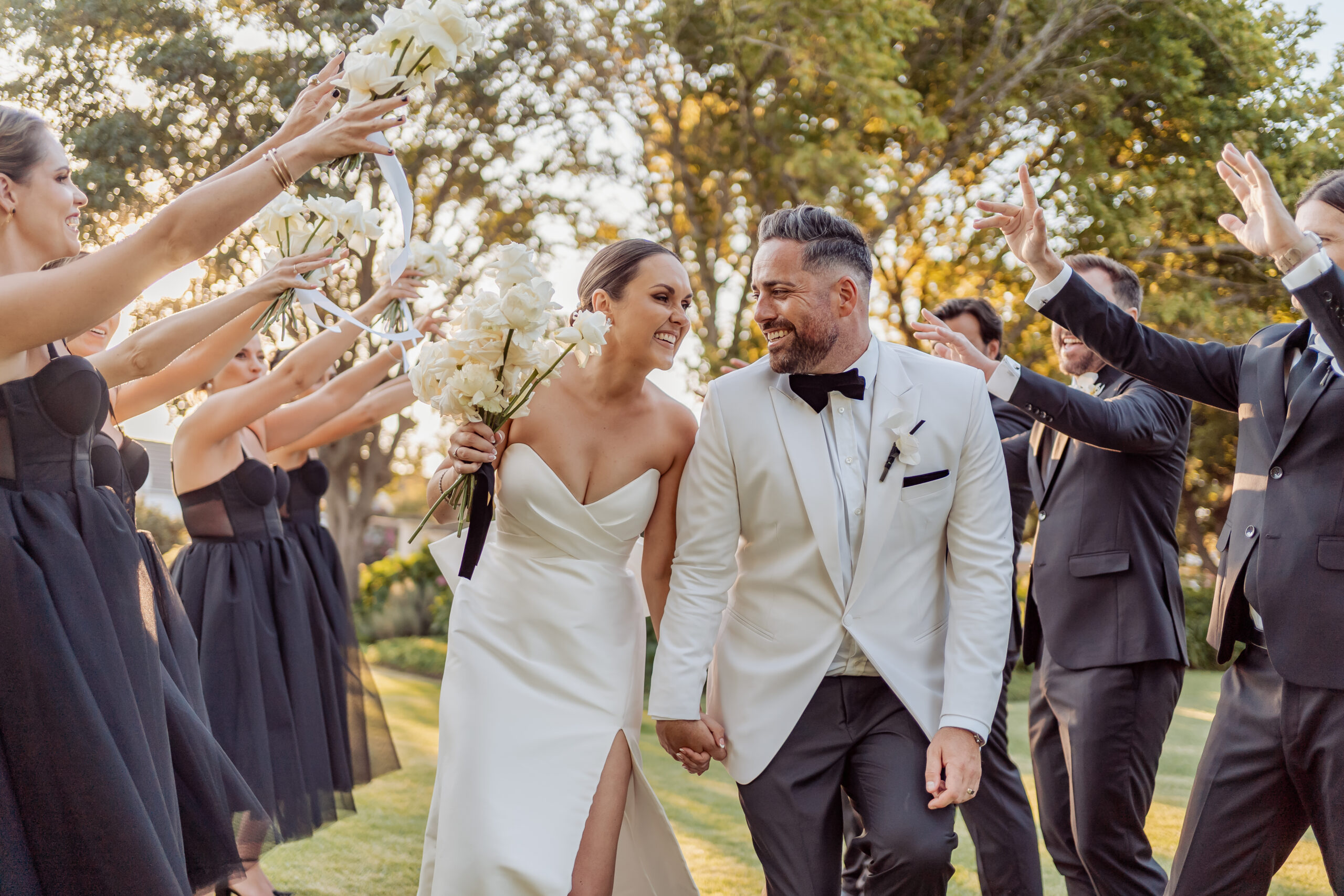 Devon and Nicole walking through their wedding party at Robertson Excelsior